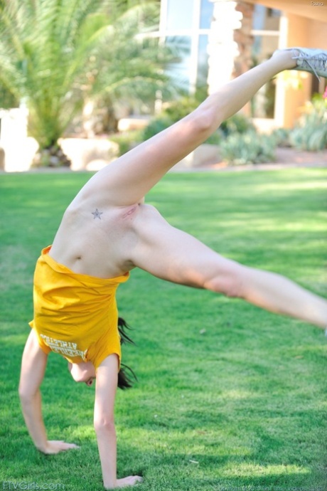 Flexy teen does a cartwheel on lawn before fisting her twat and riding a dildo 21243536