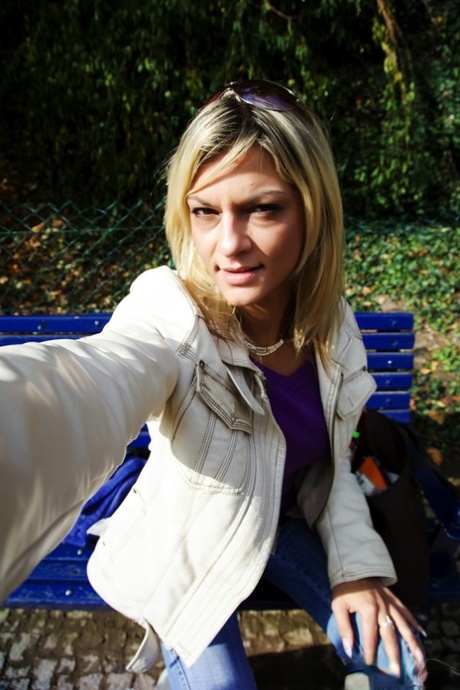 Blonde MILF takes selfies while getting totally naked in the outdoors 15600158
