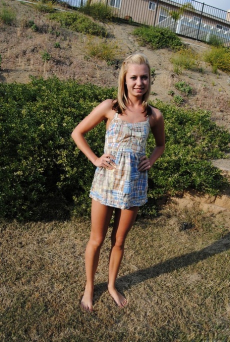 Blond amateur Tiny Tiff removes a summer dress and thong to stand nude outside 24933230