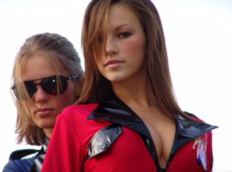 Teen lesbians Kate and Karen go topless outdoors in a teasing manner 44000178