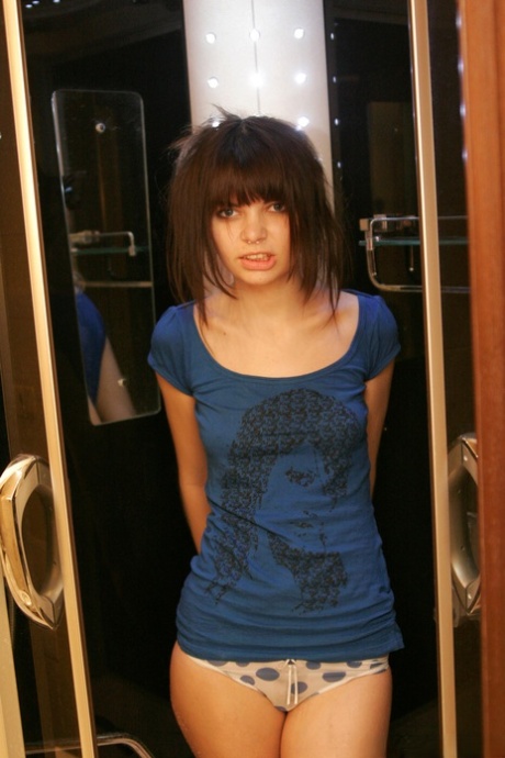 Young solo girl Kaira 18 uncovers her small tits after soaking her T-shirt 12598664