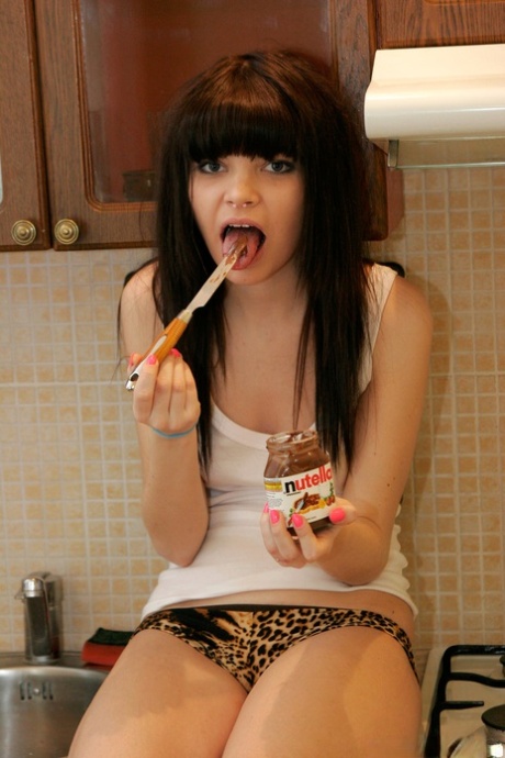 Barely legal girl Kaira 18 uncovers her small tits while partaking in a snack 18371719