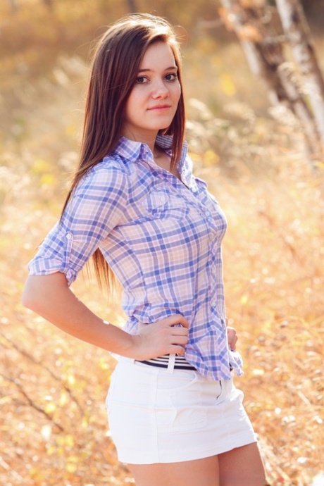 Girl next-door type Emily French uncovers her perky tits while getting naked 97286882