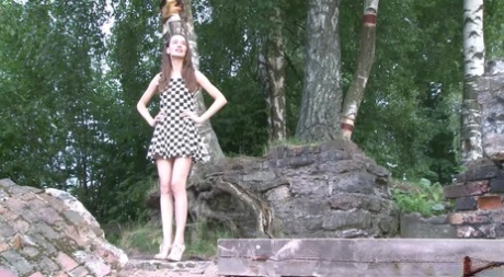 Distressed teen Oksana lifts up a checkerboard dress for an urgent pass 52048672