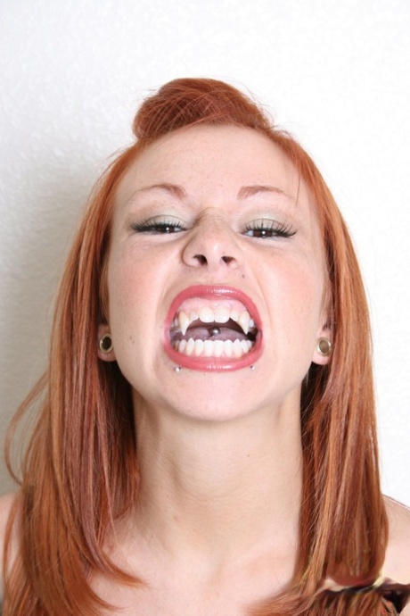 Natural redhead Scarlett wears vampire fangs and bodystocking in solo action 23355985