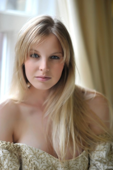 Blonde girl Rose takes off her petticoat to model in a girdle and nylons 17781924