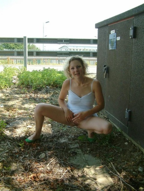 Blonde girl from the UK flashes a no panty upskirt before peeing in public 48944272