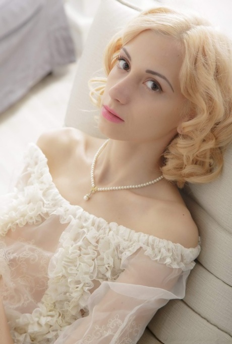 Fair skinned blonde Jenna plays with her nice twat while removing sheer attire 39653084