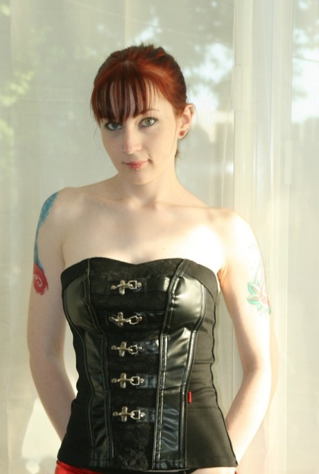 Tattooed redhead Delila Rose slides satin panties aside to expose her snatch 10267287