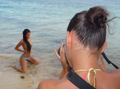 Glamour models take off their bikinis to model in the nude on a tropical beach 72824950
