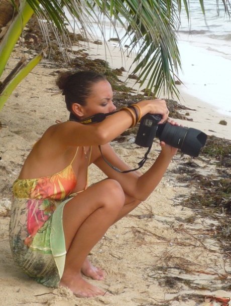 Beautiful girls work free of their swimwear while modeling on a tropical beach 81803741