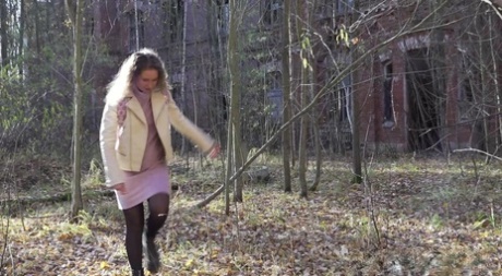 Solo girl Rita hikes up her skirt to take a piss by an abandoned building 25264219