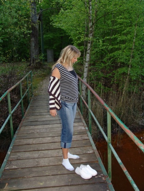 Middle-aged blonde Sweet Susi gets bare naked during a walk thru a nature park 66643426