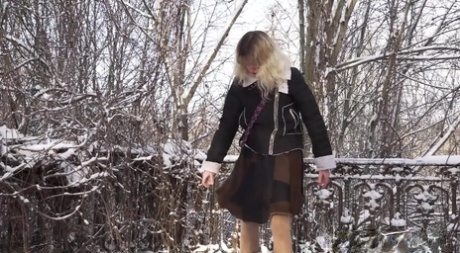 Blonde girl Jessy gets caught taking a piss upon snowy ground 53578656