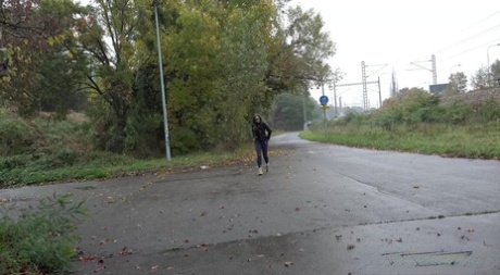 Caucasian girl Barbe takes a badly needed piss on wet pavement 96103389