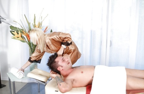 Tempting blonde masseuse gives some blowjob pleasure to her horny client 50675173