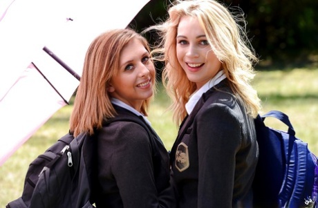 Young schoolgirls Cali Sparks and Kelly Greene tongue kissing outdoors 53220659